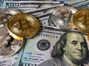 bitcoin and hundred dollar bills